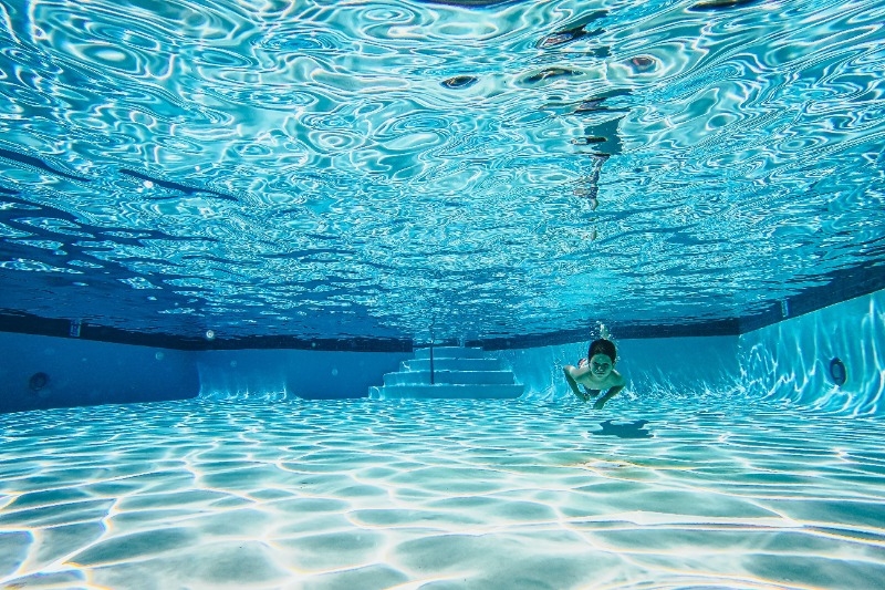 a child swimming underwater.